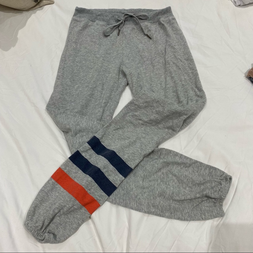 Grey slim sweatpant with stripe detail on one leg